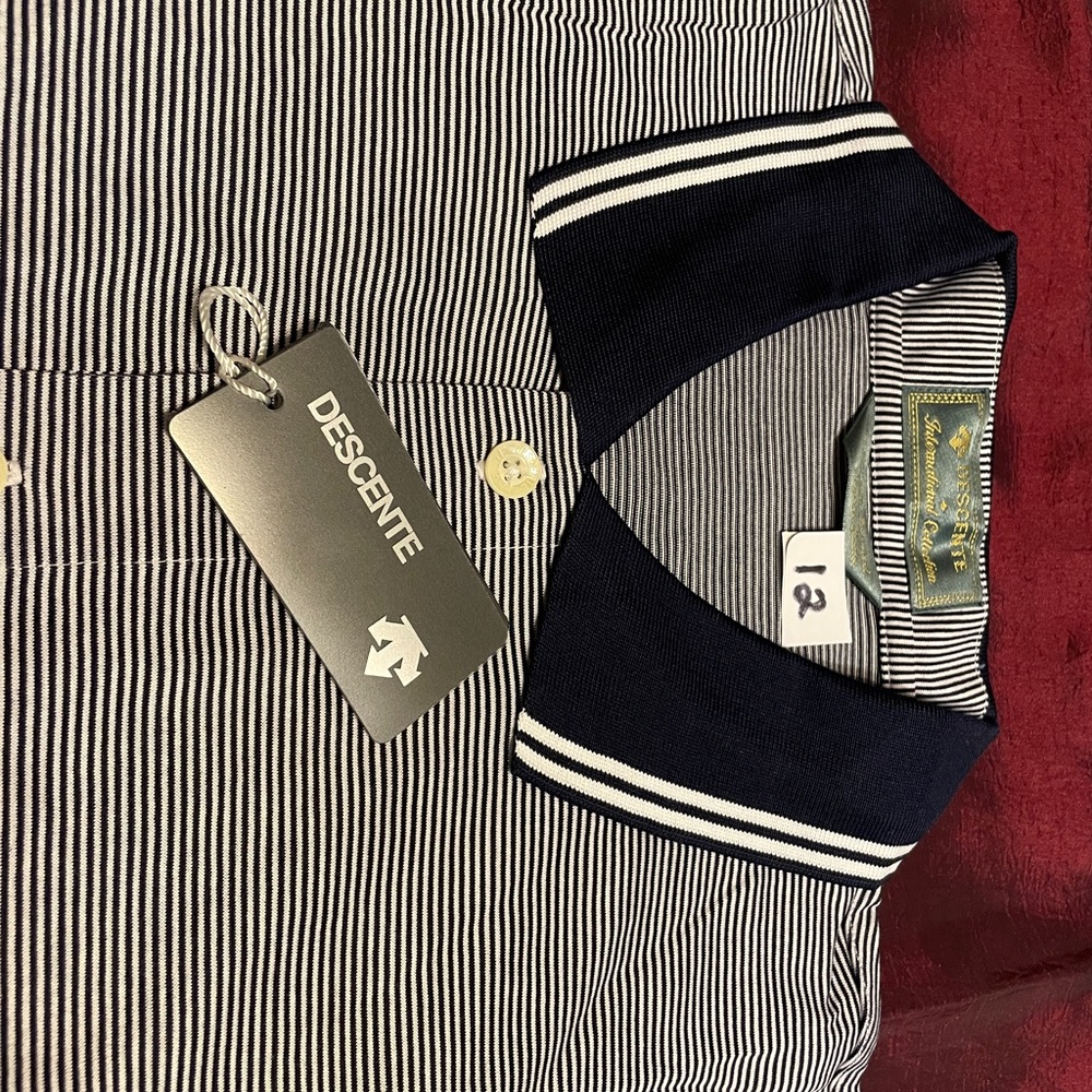 Descente Golf Shirt with golf Logic on Sleeve.